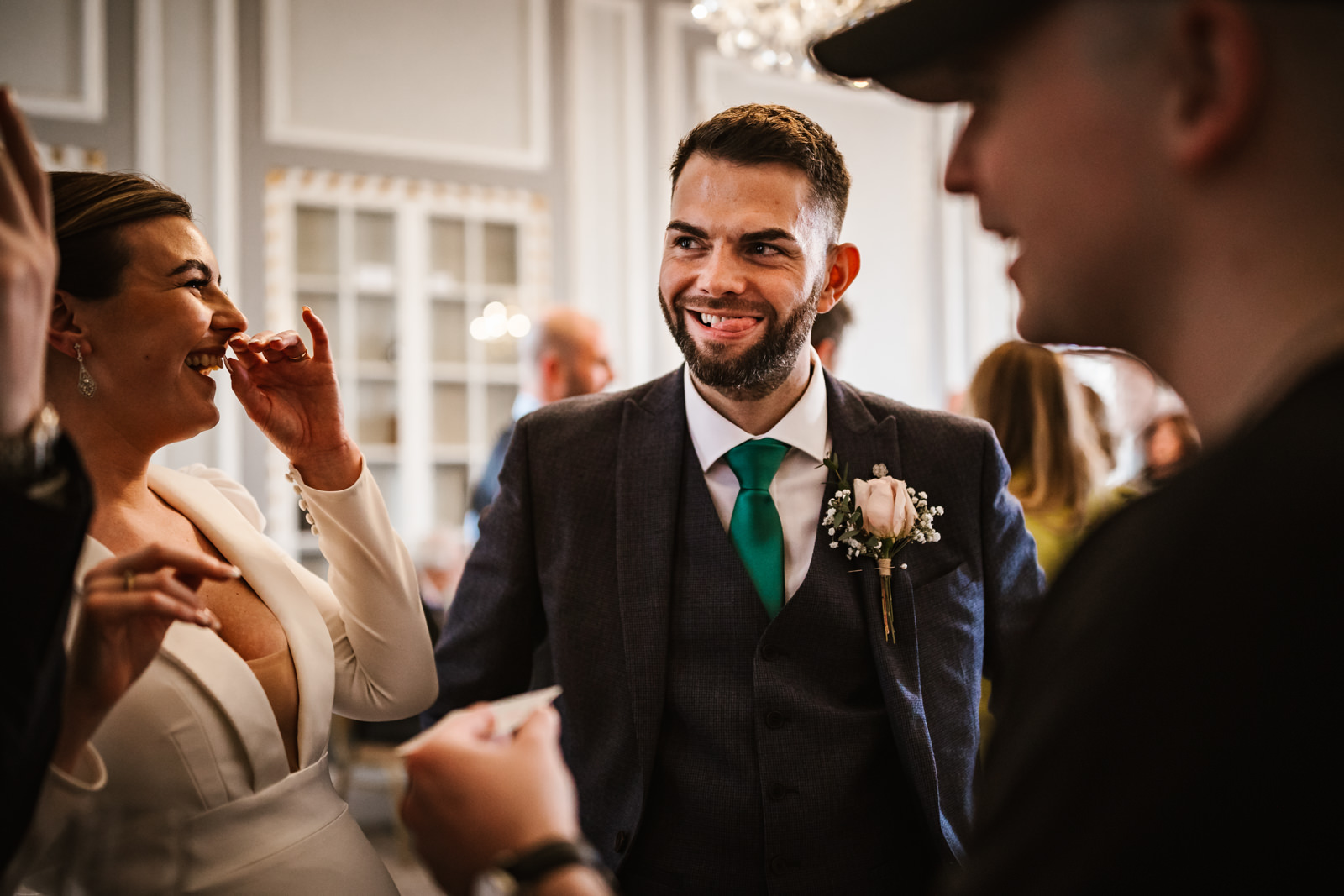Groom with his tongue out