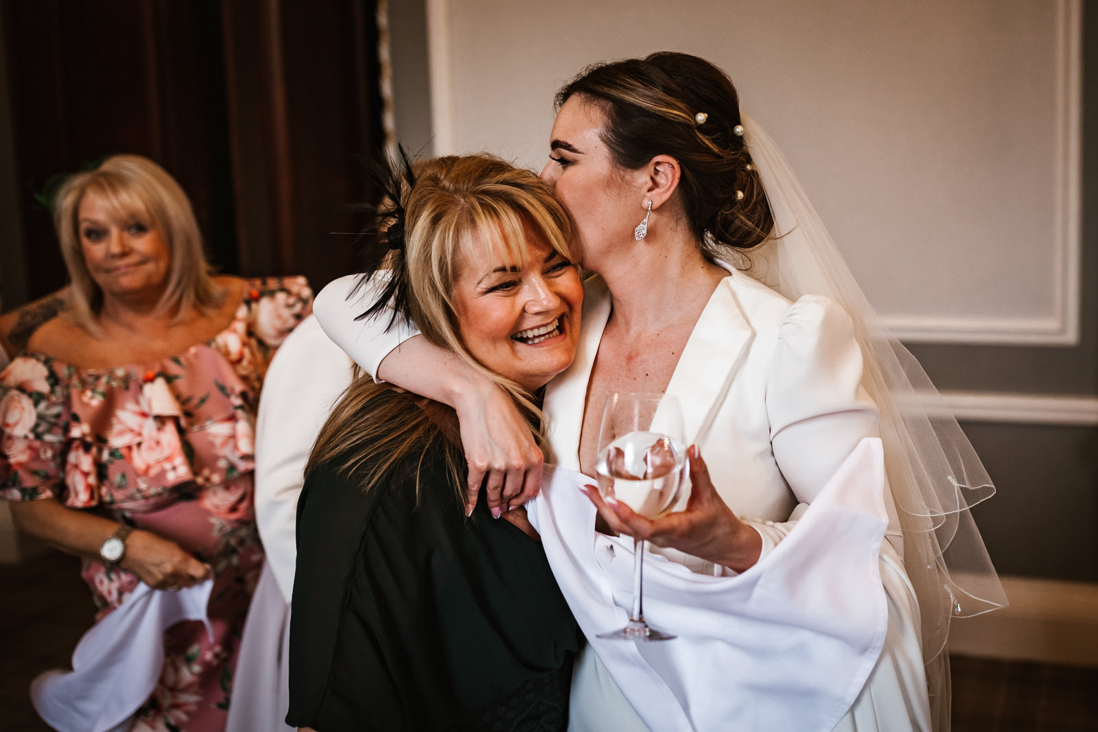 Bride kissing her friend