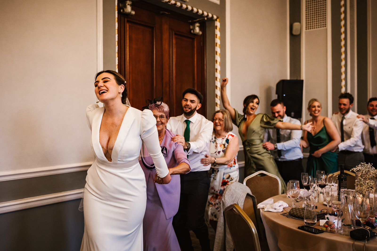 Bride leading a conga line