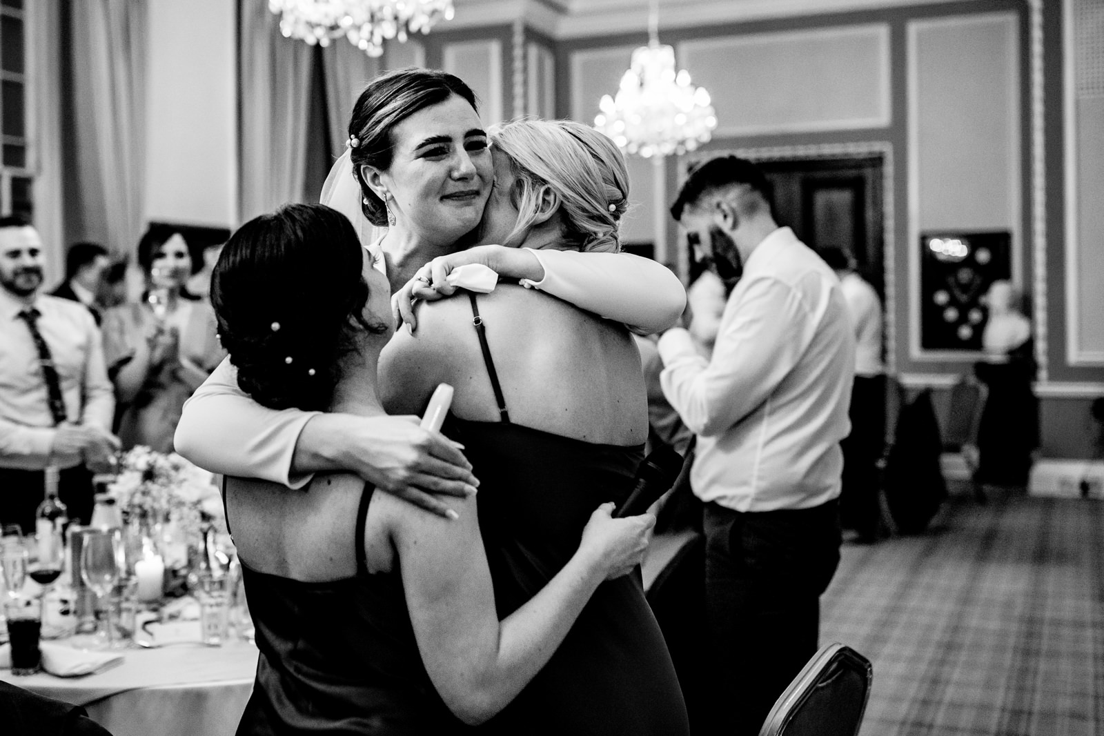 Bride hugging her best ladies