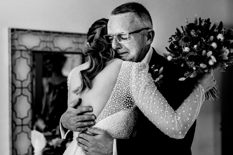 Father of the bride crying when he first sees her in her wedding dress