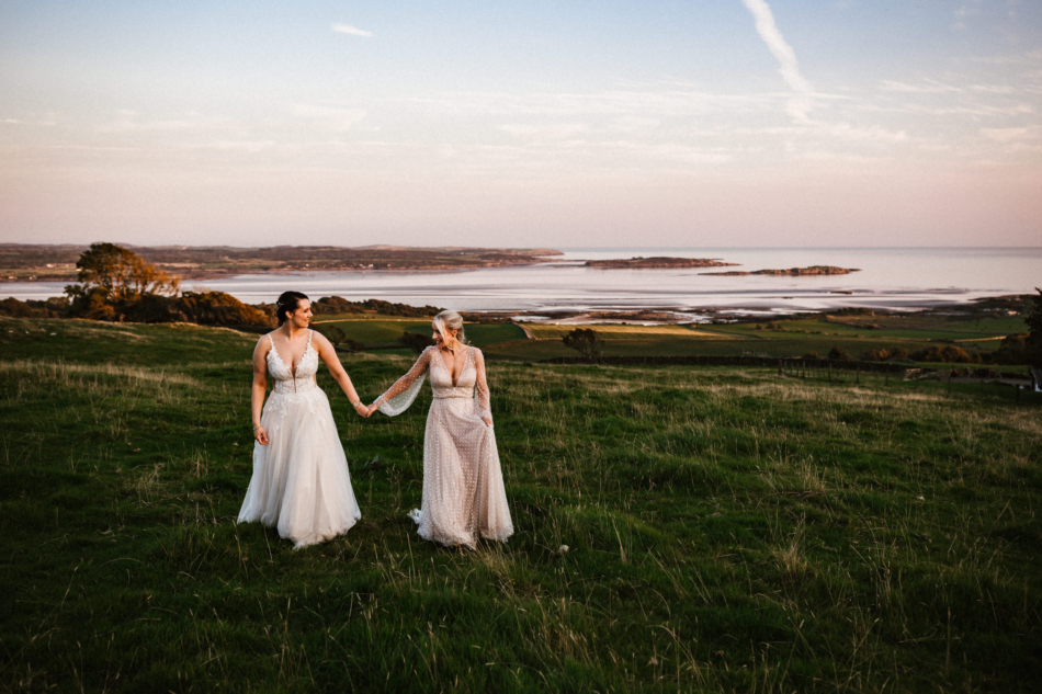 Bride and bride walking together during the golden hour