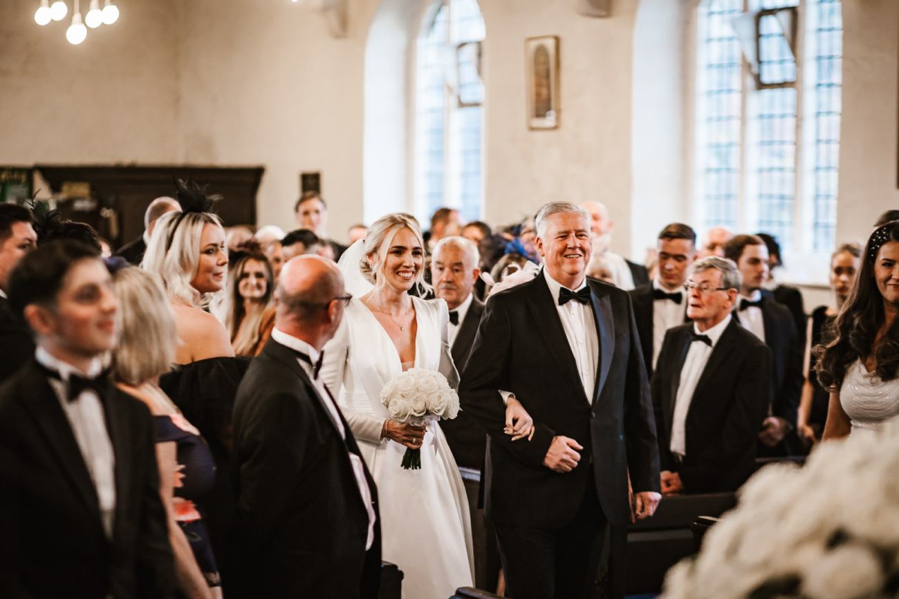 Bride walking down the aisle with her dad