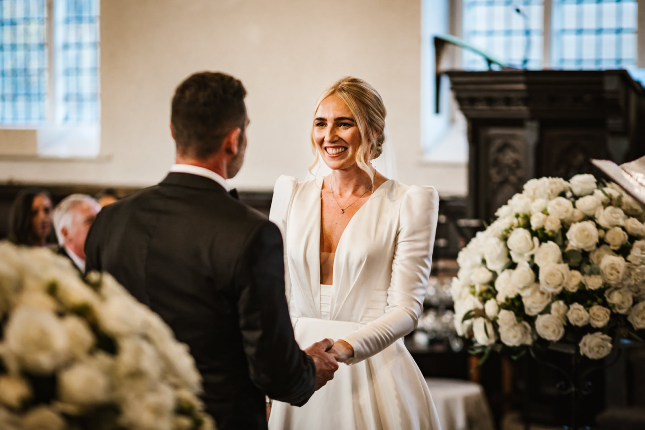 Bride and groom getting married in church