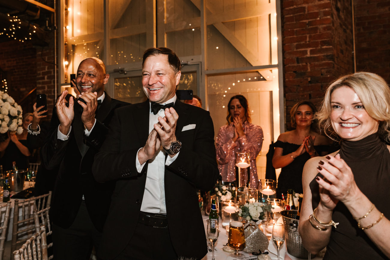 Wedding guests clap for the new Mr & Mrs