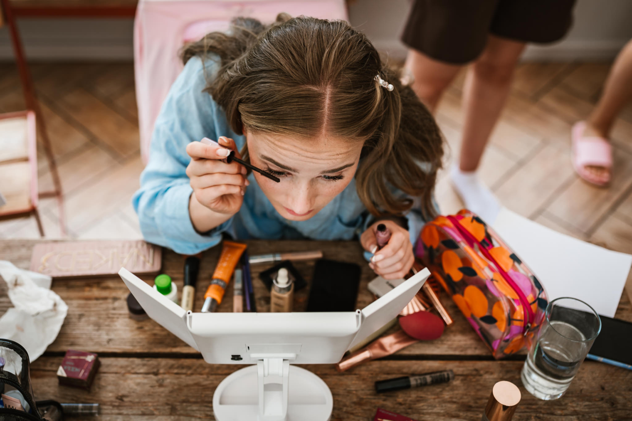 Girl applying makeup