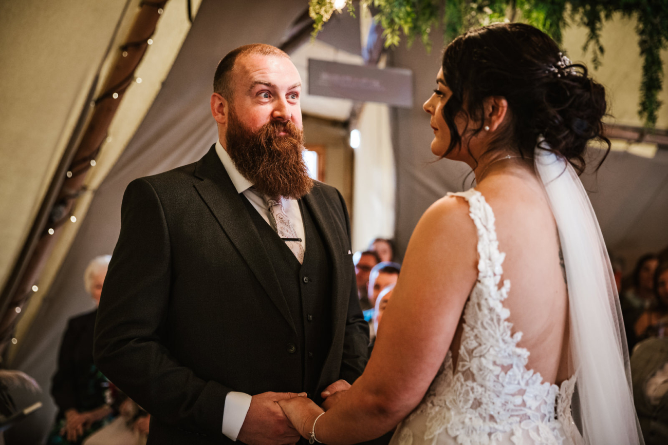 Rylands Farmhouse Wedding 17 Groom looking at his wife to be during the ceremony