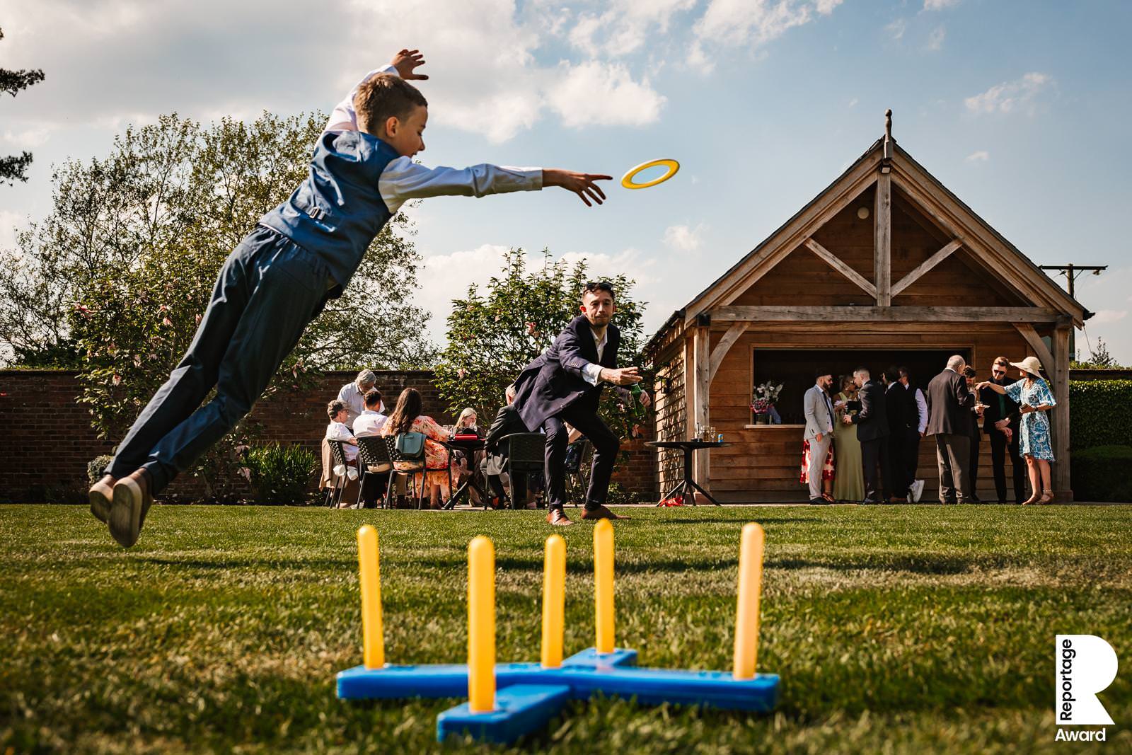 Boy diving for a frisbee at Colshaw hall