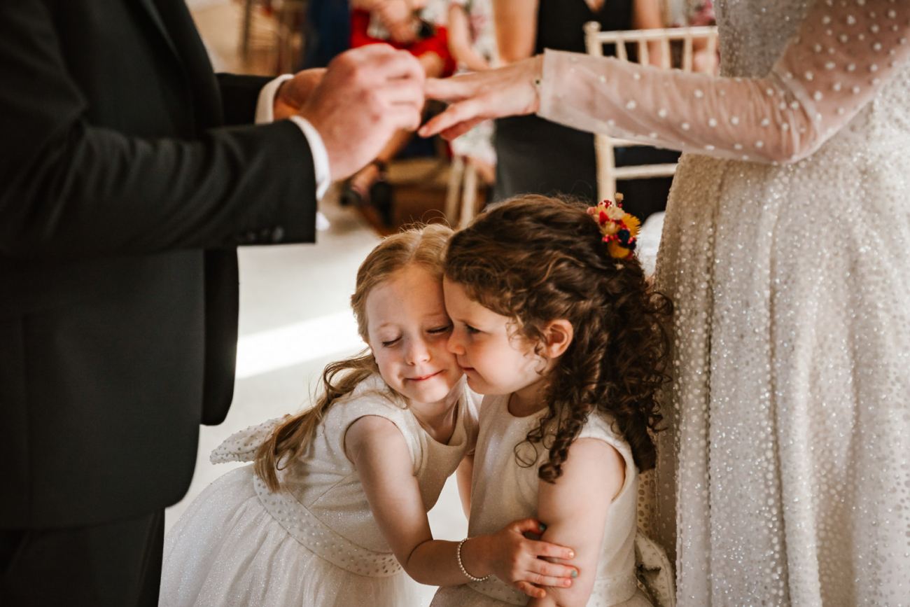 Girls hugging during ceremony at Beeston manor 
