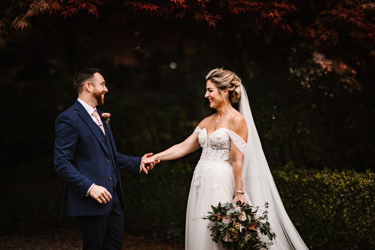 Bride and groom in the gardens at eaves Hall