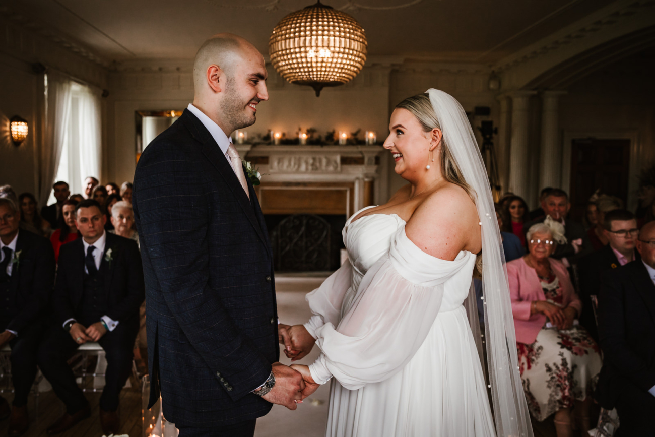Bride and groom in the ballroom at eaves Hall