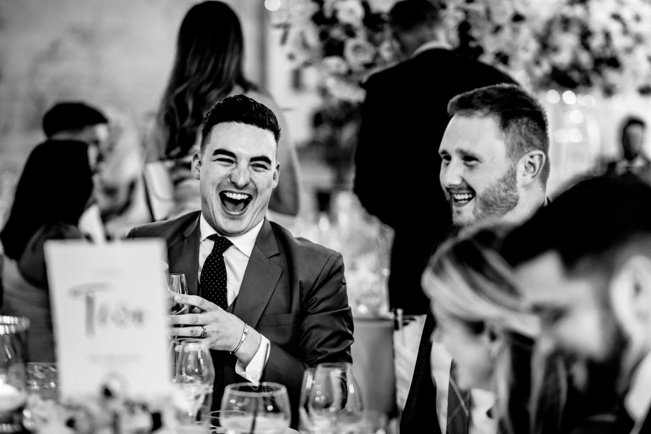 Wedding guest laughing during speeches
