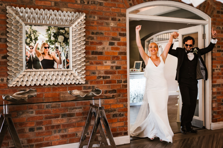 Bride and groom entering the room a Colshaw hall