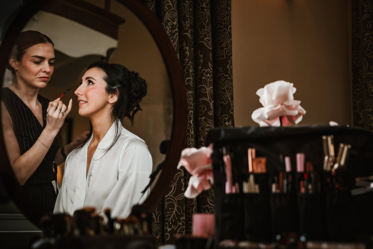 Bride getting her makeup done at Iscoys Park